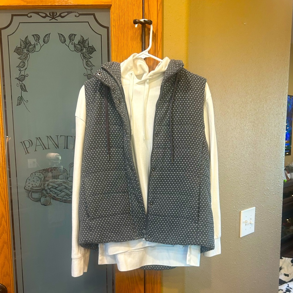 Staccato polka dot vest.